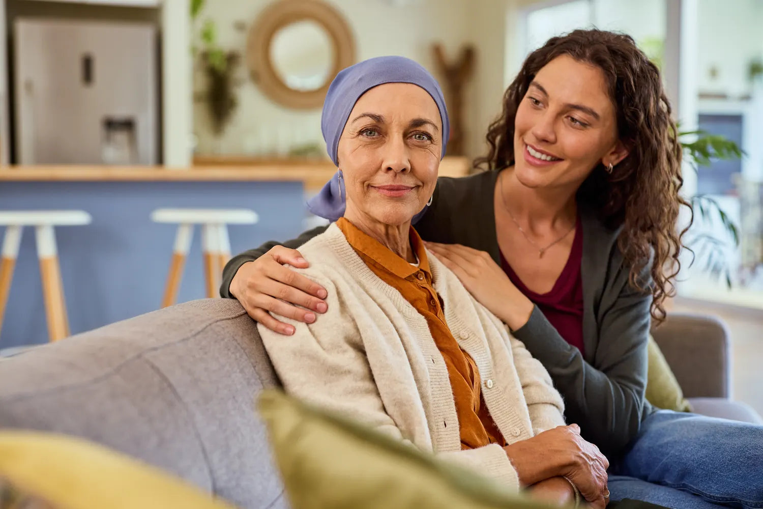 A woman in recovery smiling with her daughter's support