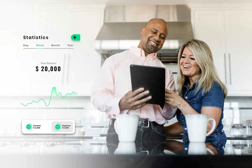 A couple reviewing their portfolio on a tablet