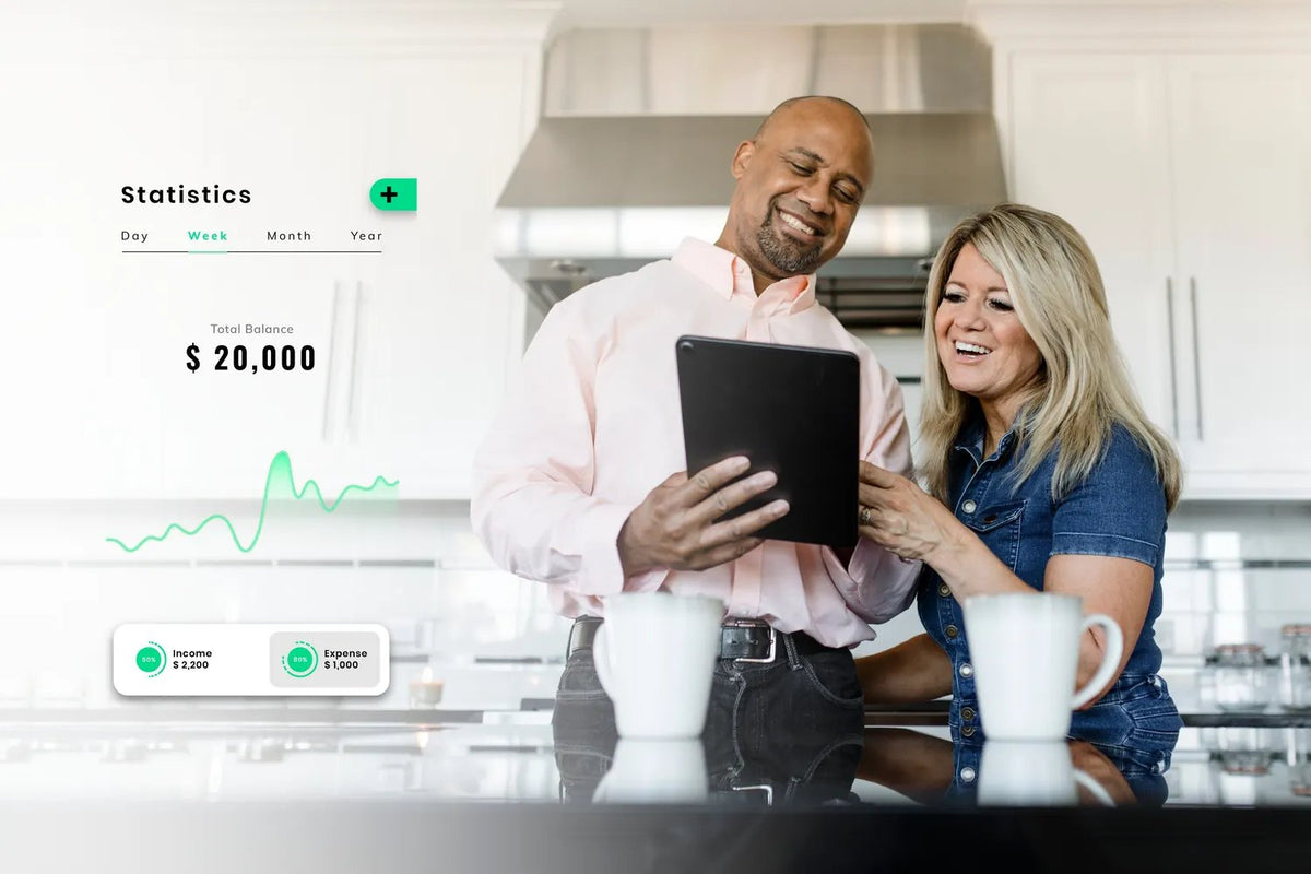 A couple reviewing their portfolio on a tablet