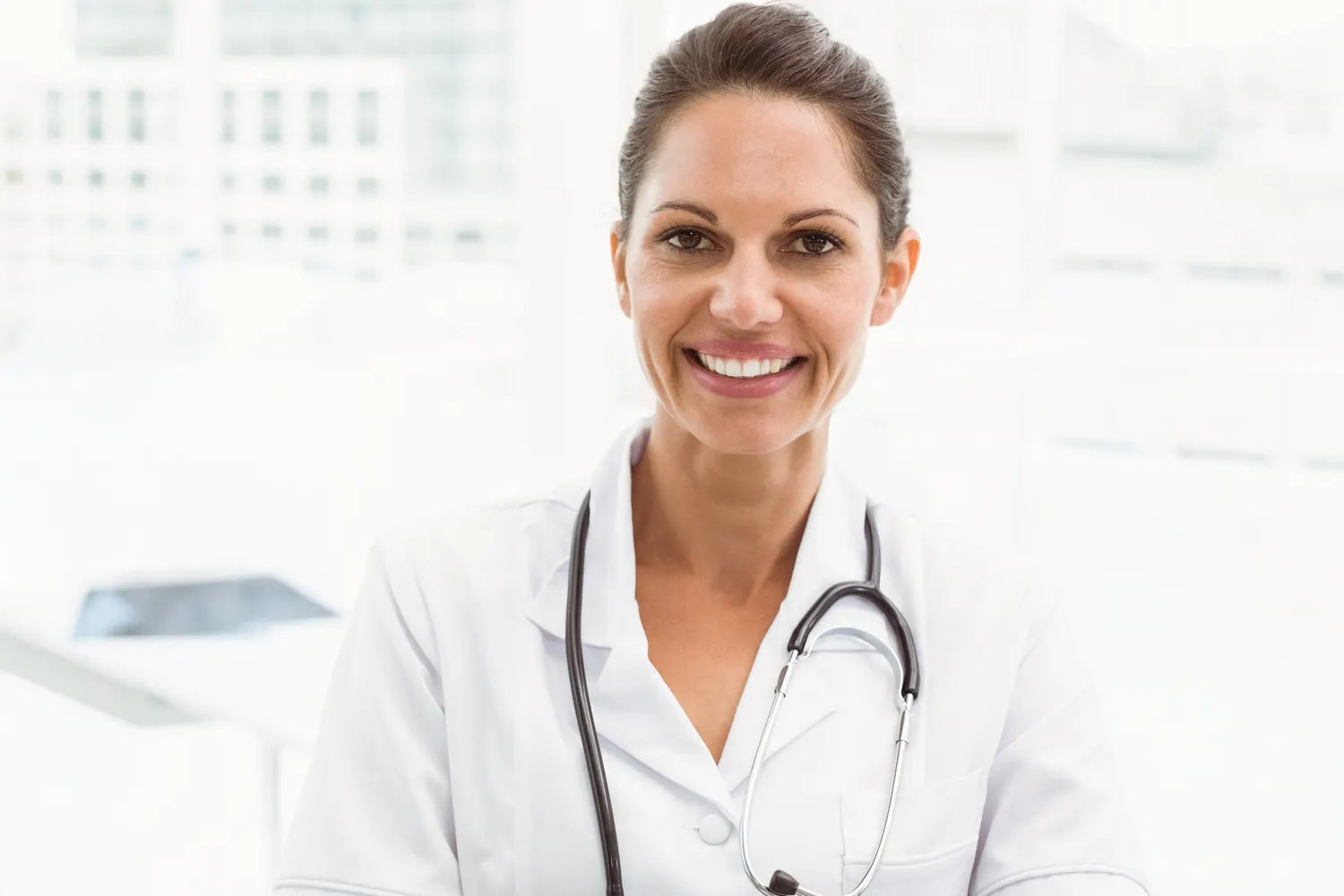 Physician smiling in a bright clinic