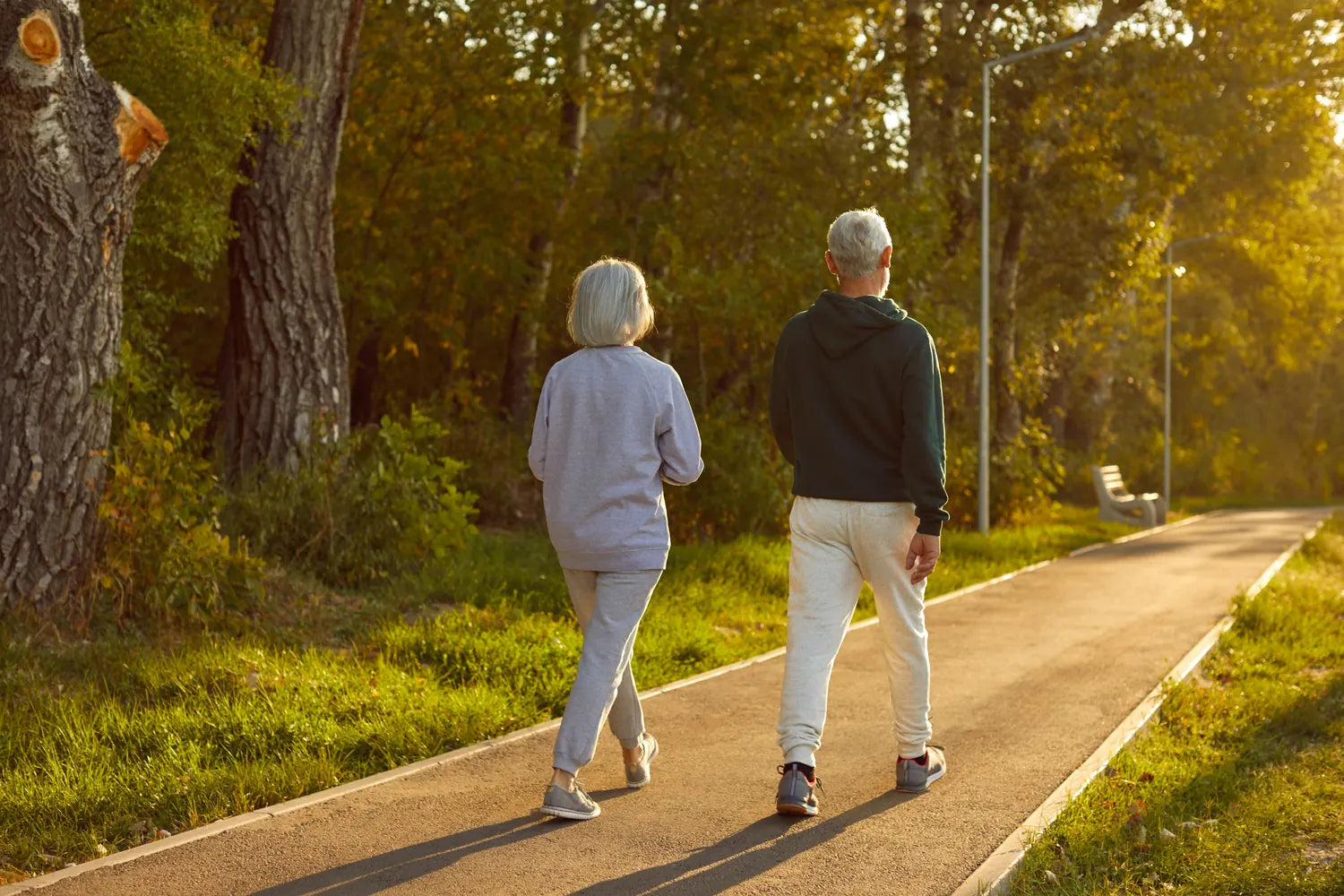 Retired couple laughing on an autumn walk